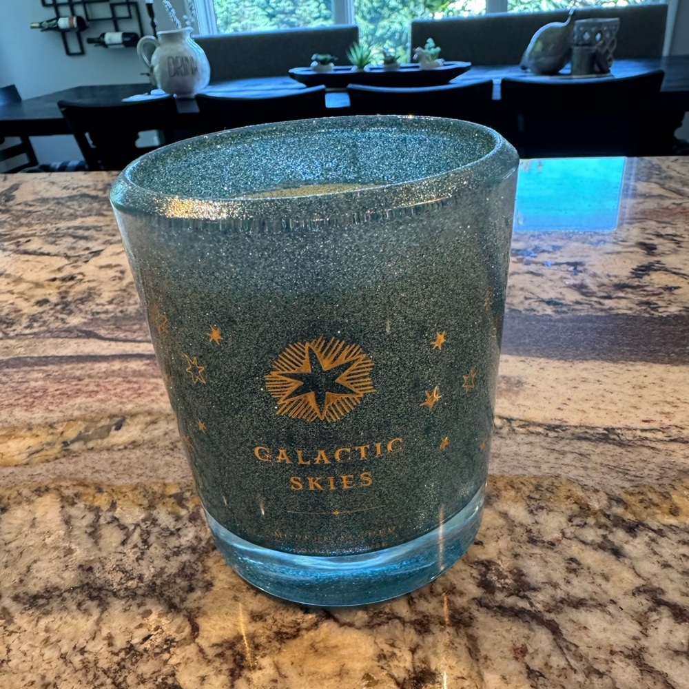 Elegant Blue and Gold Candle with Galactic Accents